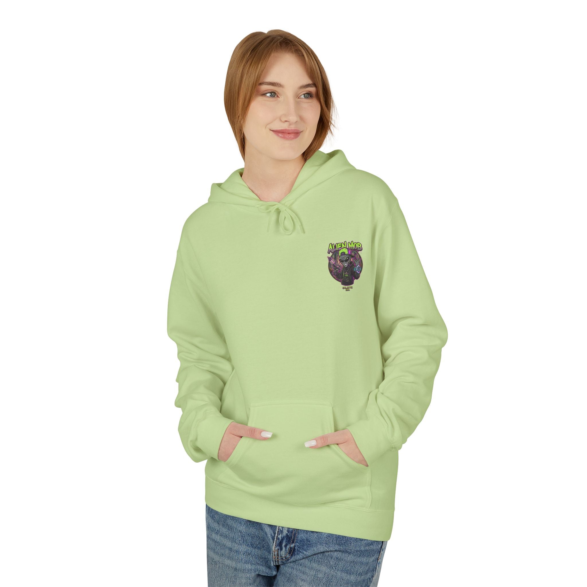 Pistachio green alien hip hop pullover hoodie worn by woman front view showing Alien Mob chest crest – Galactic Era streetwear

