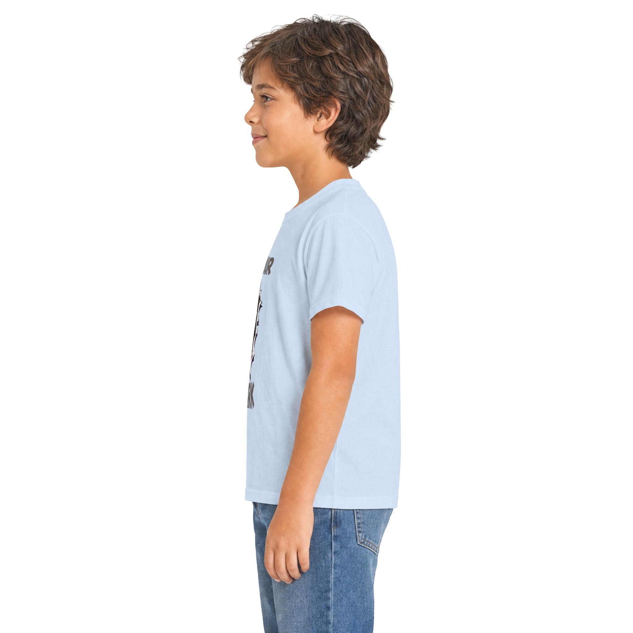 A child model shown in profile wearing a light blue t-shirt with colorful graphic prints on the front and sleeve, paired with blue jeans against a plain white background.