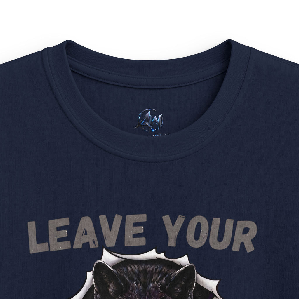 Close-up of a navy blue t-shirt featuring the distressed gray text 'LEAVE YOUR' above a graphic of a black wolf head bursting through torn paper, with a circular blue and white logo printed inside the collar.