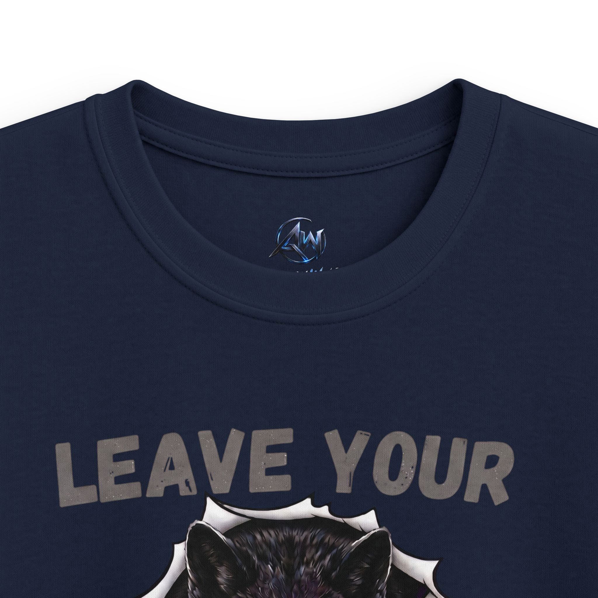 Close-up of a navy blue t-shirt featuring the distressed gray text 'LEAVE YOUR' above a graphic of a black wolf head bursting through torn paper, with a circular blue and white logo printed inside the collar.