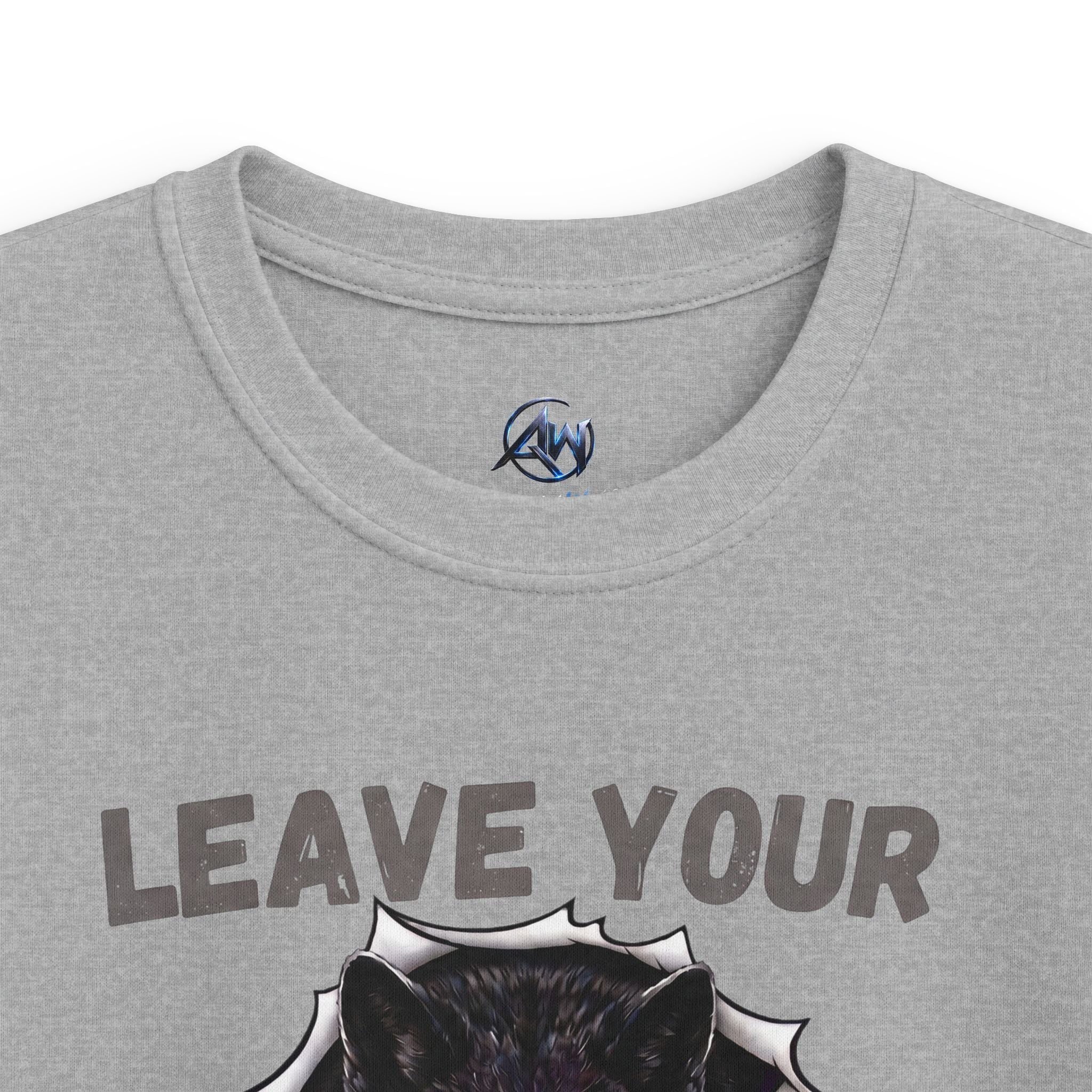 Close-up of a heather gray t-shirt featuring the text 'LEAVE YOUR' above a graphic of a black wolf head bursting through a white jagged shape. A small circular blue and black logo is printed inside the collar.