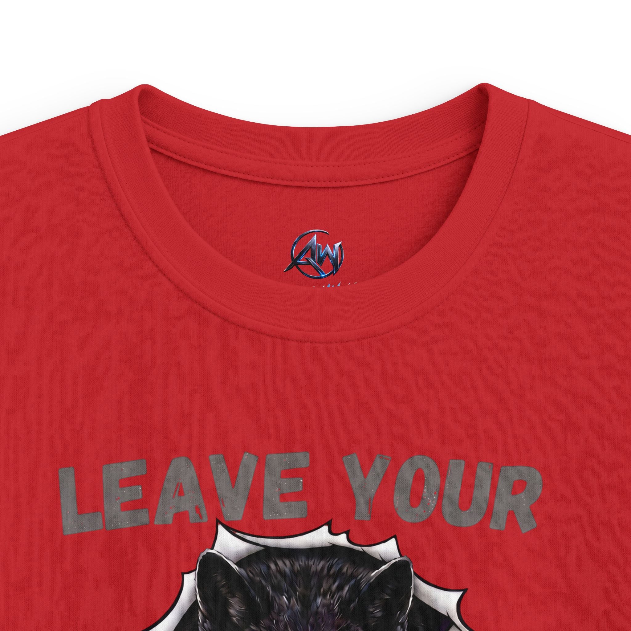 Close-up of a red short-sleeve crewneck t-shirt featuring a graphic print of a black wolf head and the distressed gray text 'LEAVE YOUR'. A small circular logo is visible inside the collar.