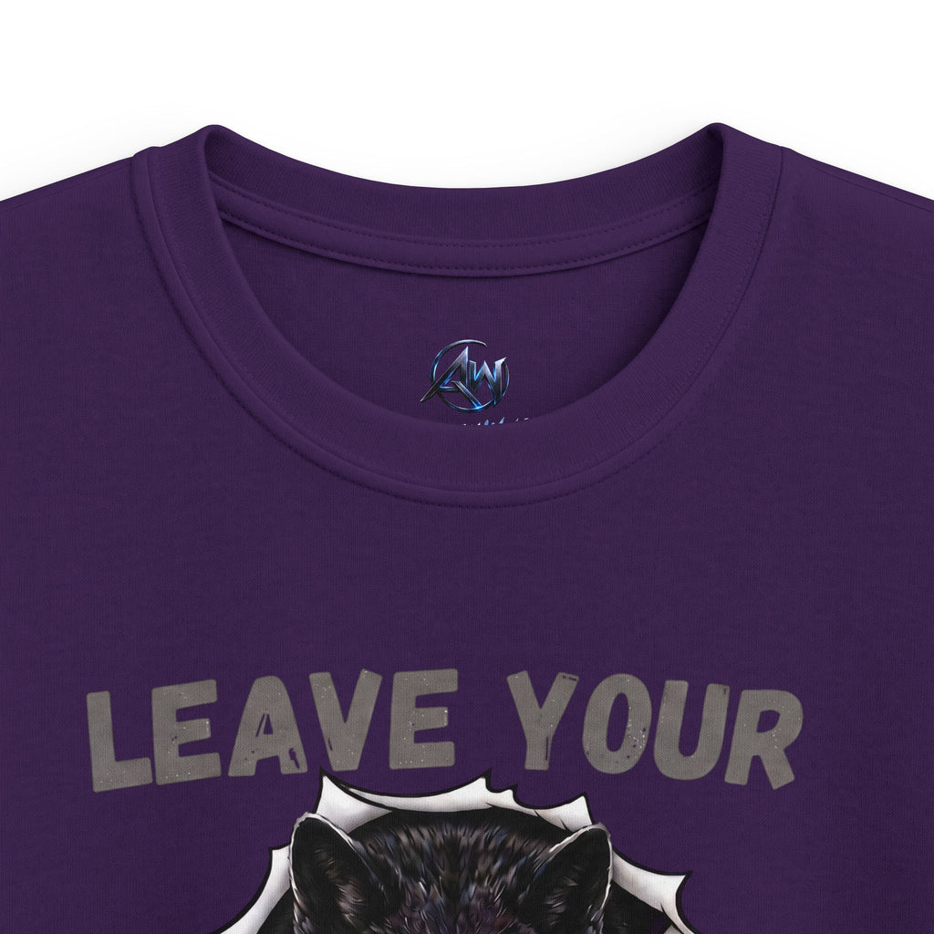 Close-up of a purple crew neck t-shirt featuring a graphic of a black wolf head bursting from a white circular frame, with the distressed gray text 'LEAVE YOUR' above it. A small blue and black circular logo is printed inside the collar.