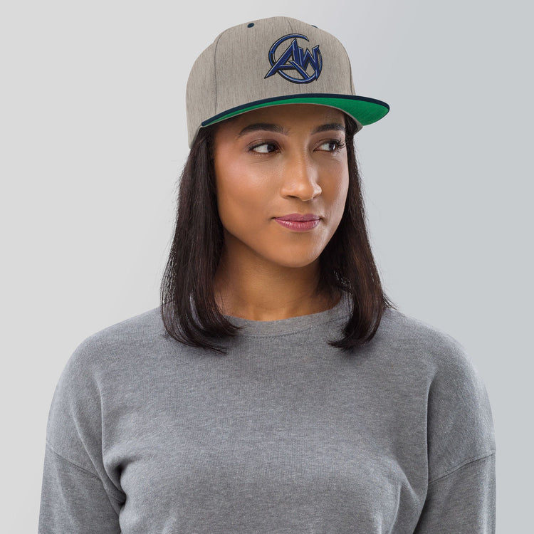 Woman wearing a cap with 'logo AW text on a plain background