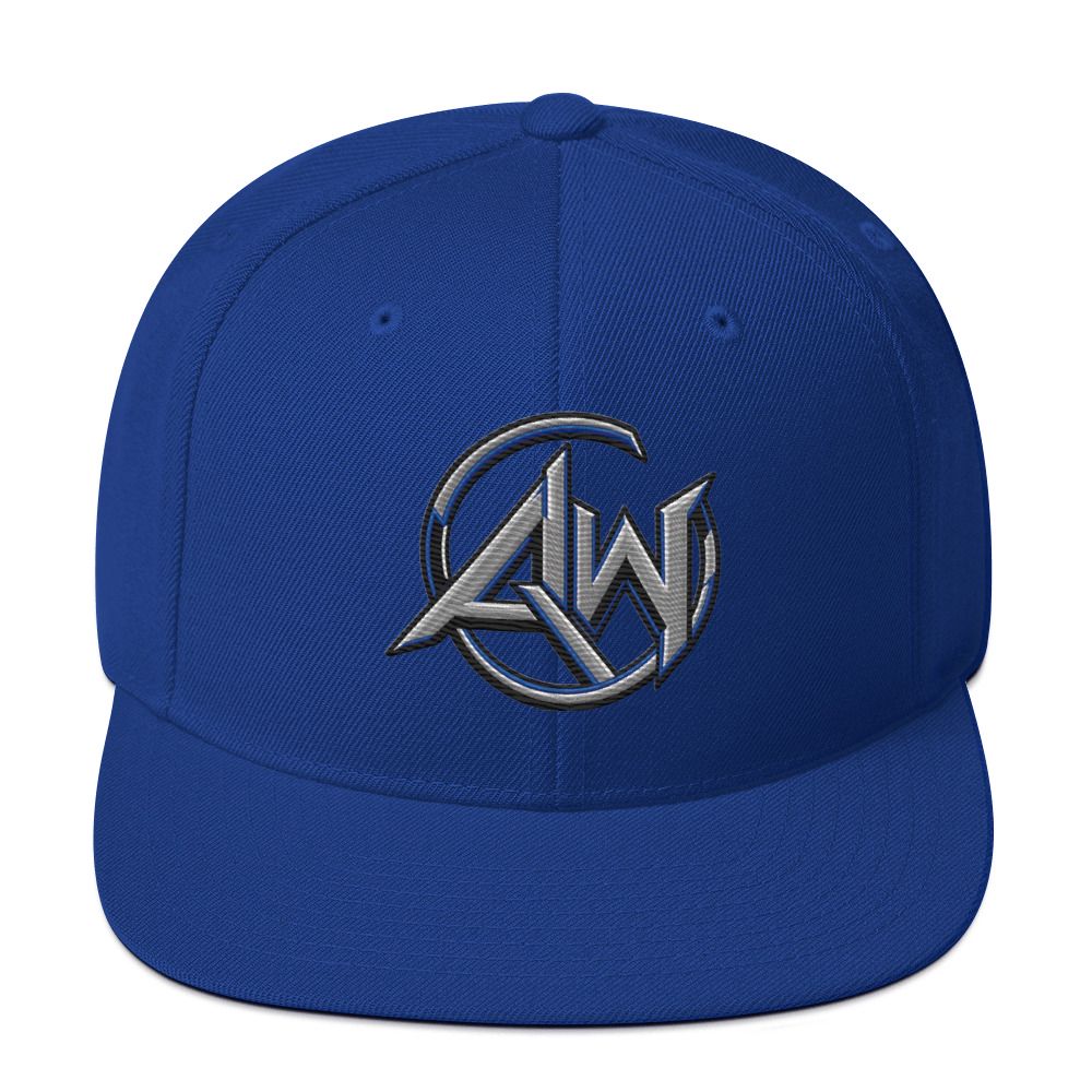 A royal blue structured baseball cap with a flat brim, featuring a metallic silver embroidered AW logo on the front center.