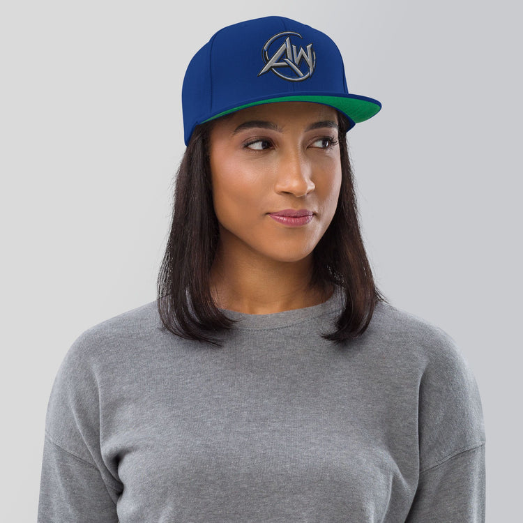 woman  wearing a blue cap with AW' text on a gray background