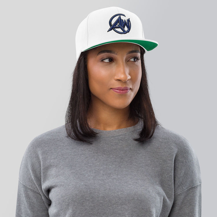 Person wearing a white cap with 'AW branding on a gray background