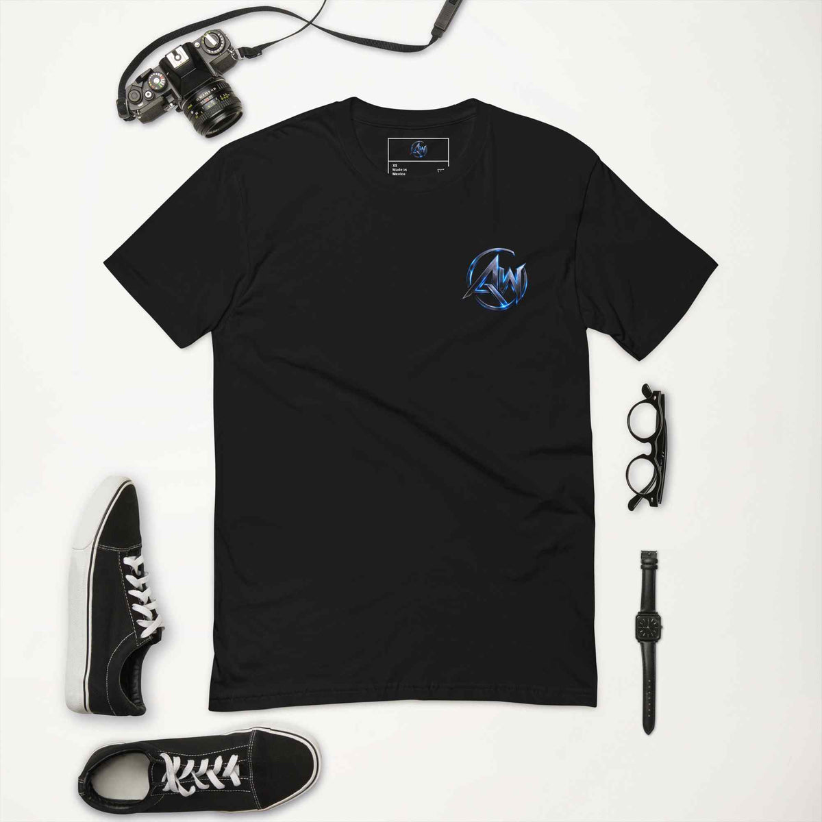 Black t-shirt with AW logo on a white background, surrounded by a camera, shoes, and accessories.