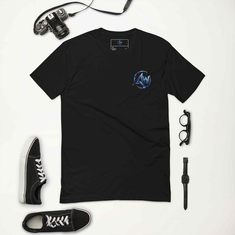 Black t-shirt with AW logo on a white background, surrounded by a camera, shoes, and accessories.