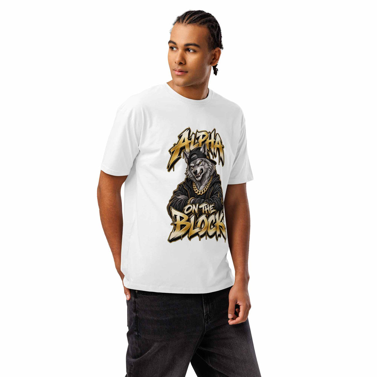 A man wearing a white short-sleeve graphic wolf  t-shirt with a black and gold illustration and the text 'ALPHA ON THE BLOCK'.