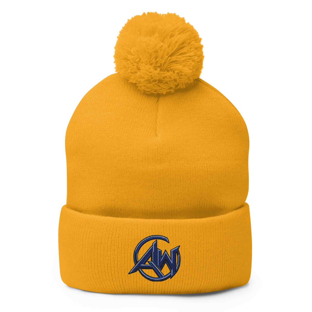 A mustard yellow knit pom-pom beanie with a folded cuff and a navy blue embroidered circular AW logo on the front, shown against a plain white background.