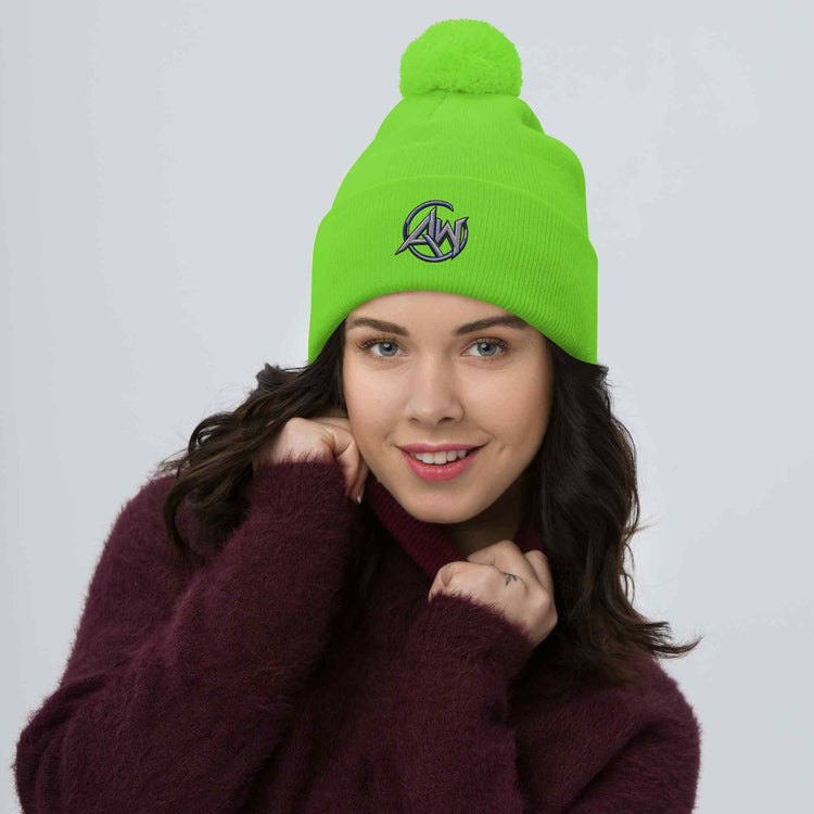 woman wearing a bright green beanie with an AW Crest  logo on a plain background