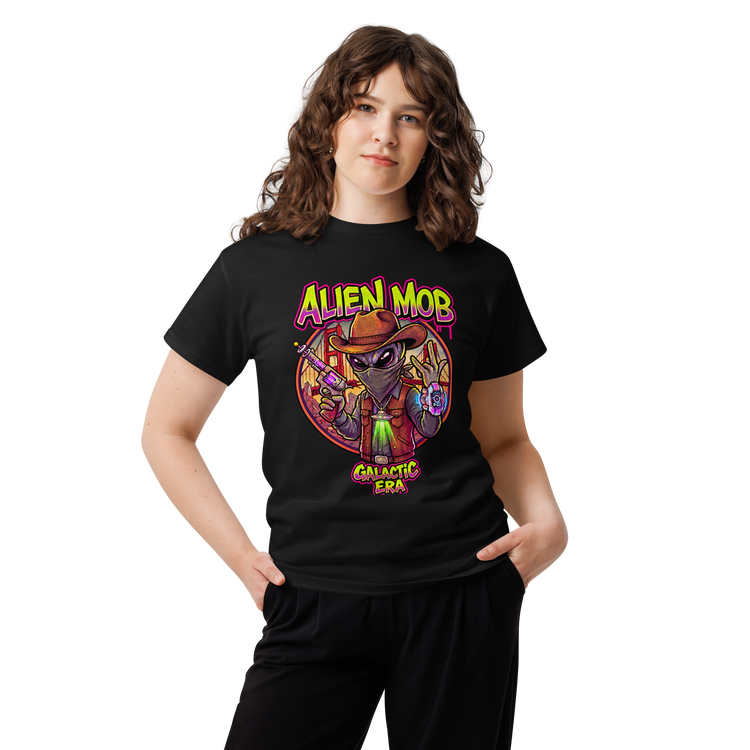 A woman modeling a black short-sleeve graphic t-shirt with a colorful 'Alien Mob Galactic Era' design on the front, set against a plain white background.