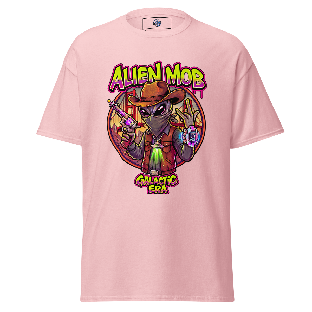 A light pink short-sleeve t-shirt with a colorful graphic print on the front. The graphic features a cartoon alien wearing a brown hat and vest, holding a gun, with the text 'ALIEN MOB' above and 'GALACTIC ERA' below.