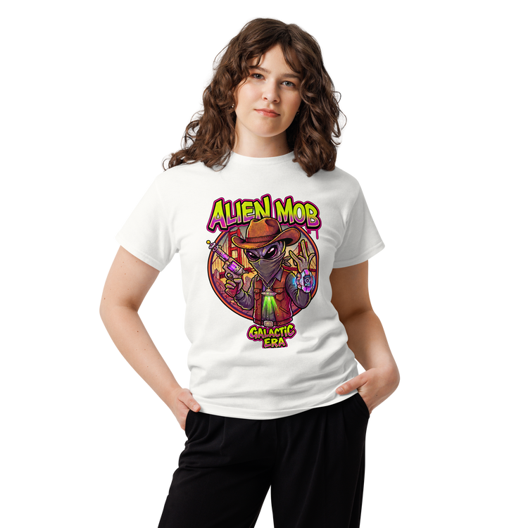A woman modeling a white short-sleeve graphic t-shirt featuring a colorful cartoon alien design with the text 'ALIEN MOB' and 'GALACTIC ERA'.