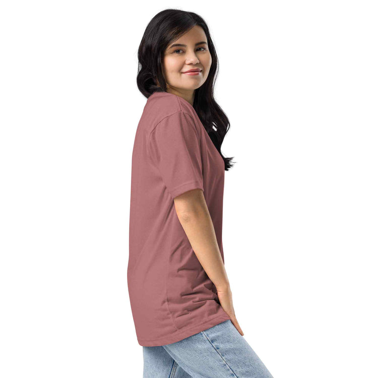 Woman wearing a mauve t-shirt against a white background