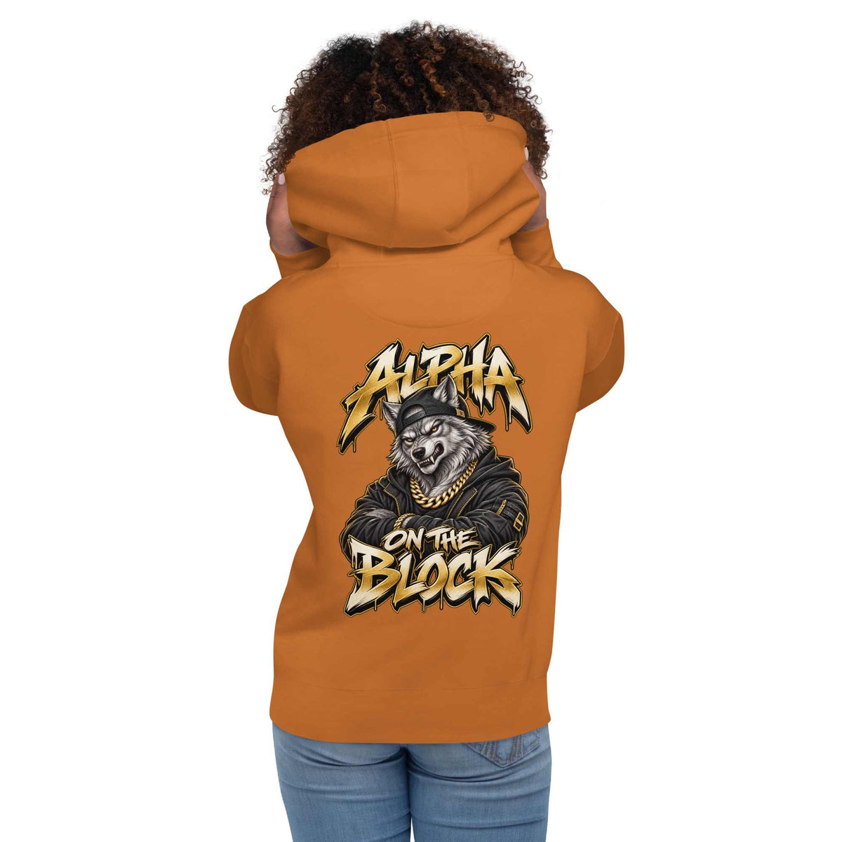 A woman shown from the back wearing an orange hoodie with a large graphic wolf on the back  and the text 'ALPHA ON THE BLOCK'.
