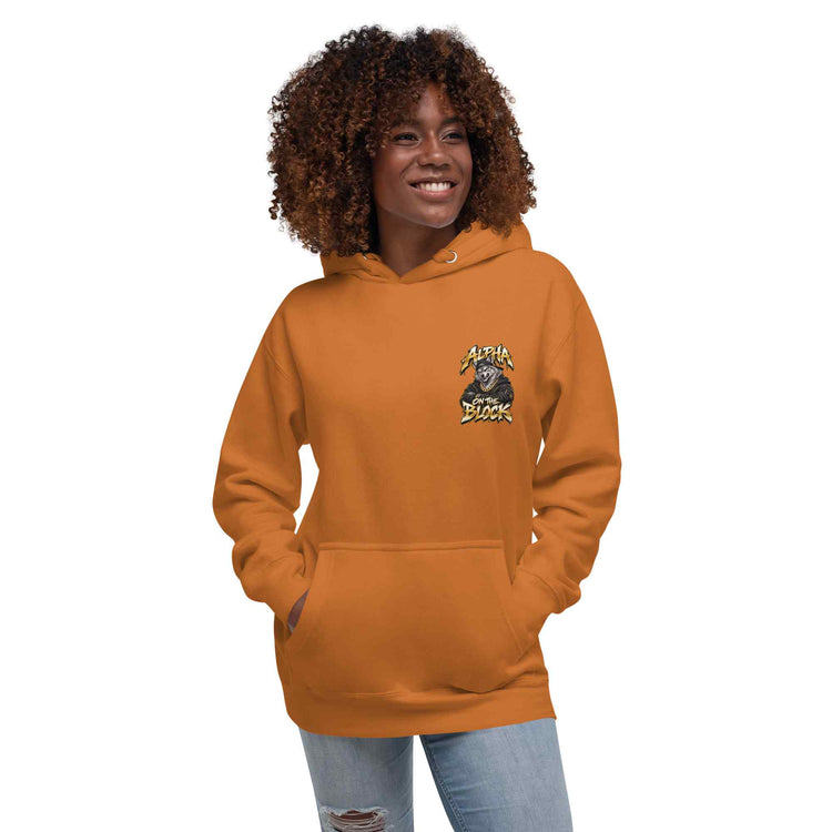 Black model woman with brown curly hair wearing an orange hoodie with a wolf  logo on a white background