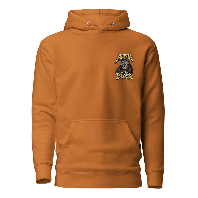 A burnt orange pullover hoodie with a small 'Alpha On The Block' printed on the left chest, displayed on a clean white background.