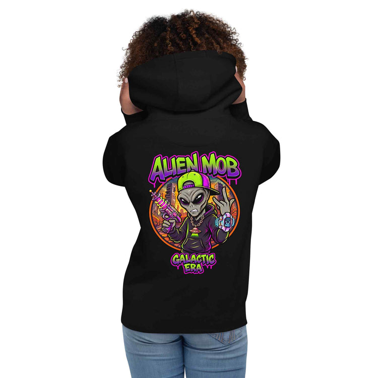 A woman with brown curly hair shown from the back wearing a black hoodie with a colorful graphic on the back. The graphic features an alien character with the text 'ALIEN MOB' and 'Galactic Era'.