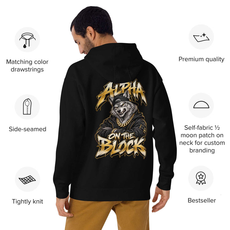 Person wearing a black hoodie with a detailed wolf graphic on the back, standing against a white background