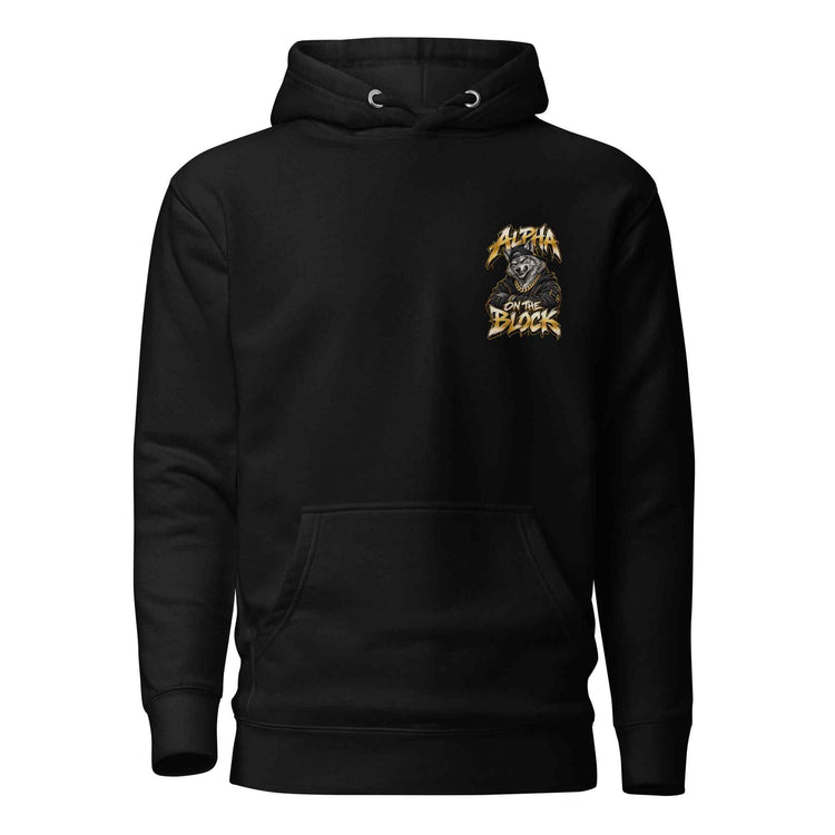 A black pullover hoodie with a small graphic wolf  on the left chest reading 'ALPHA ON THE BLOCK in white, orange, and gray, shown on a plain white background.