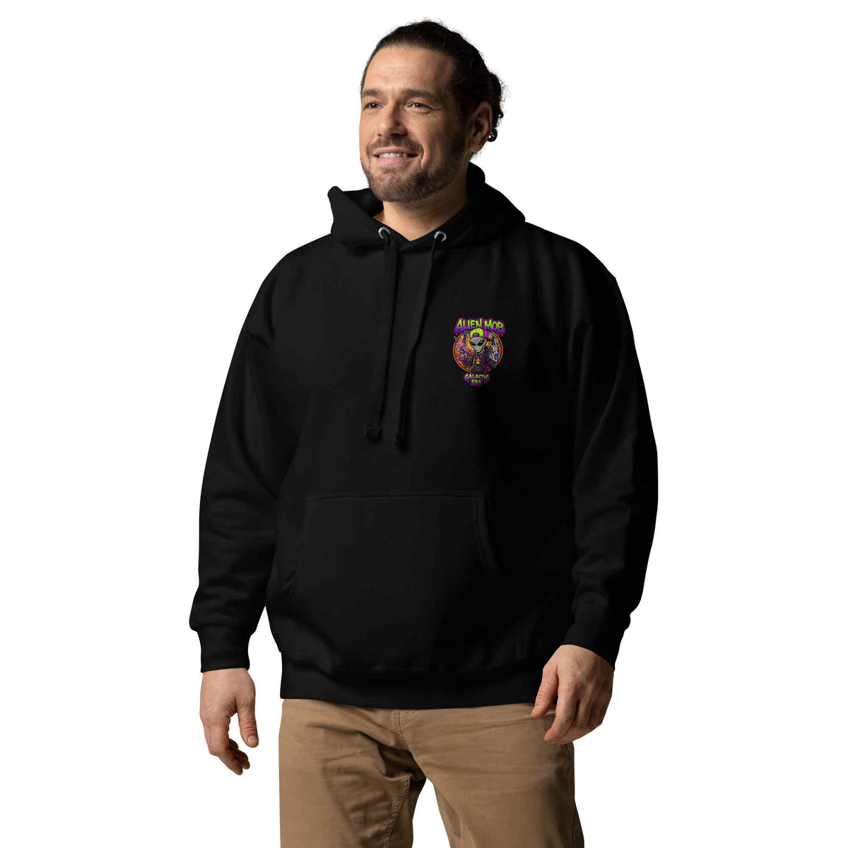 Man wearing a black hoodie with an alien Mob logo on  the left side chest on a white background