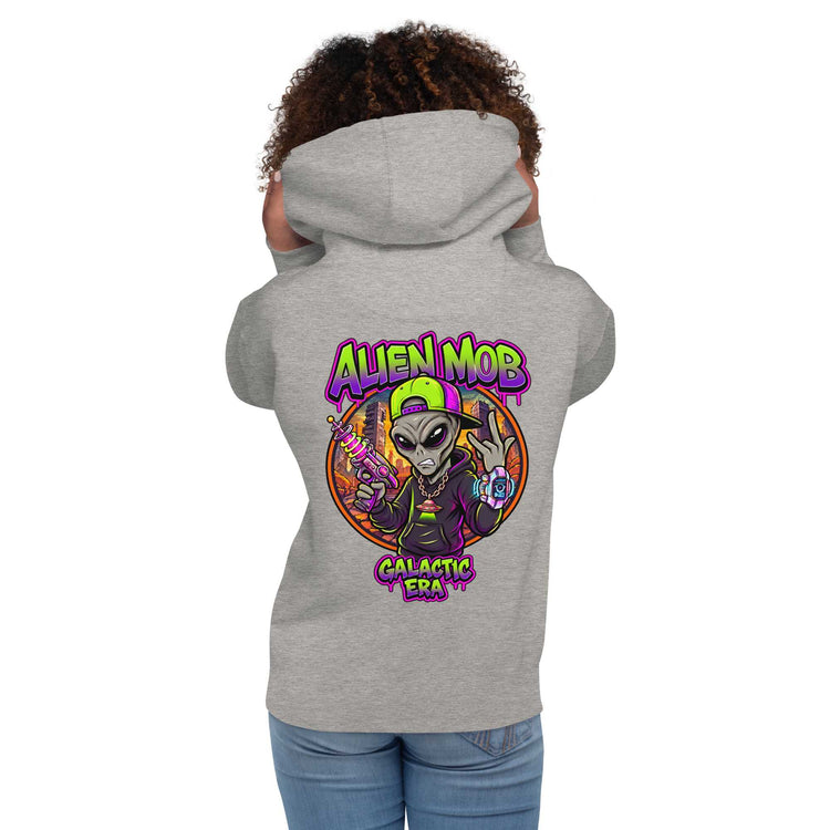 A woman shown from the back wearing a Carbon stone light gray hoodie with a large colorful graphic on the back featuring an alien character and the text 'ALIEN MOB' and 'Galactic Era'.