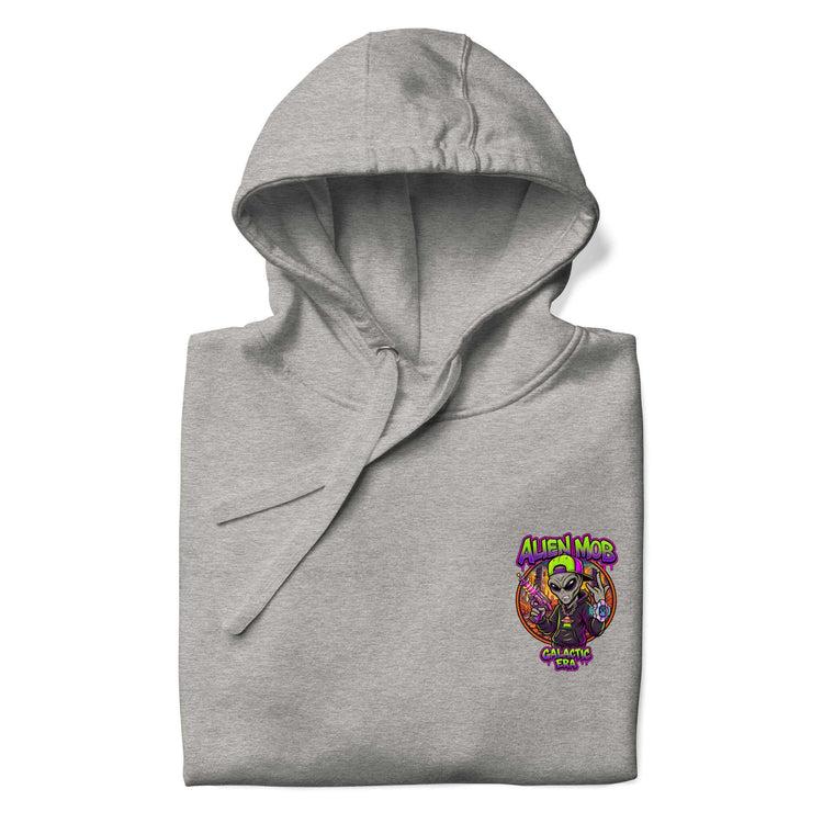 A folded carbon stone light gray hoodie with a colorful graphic on the left chest featuring a cartoon alien and the text 'ALIEN MOB