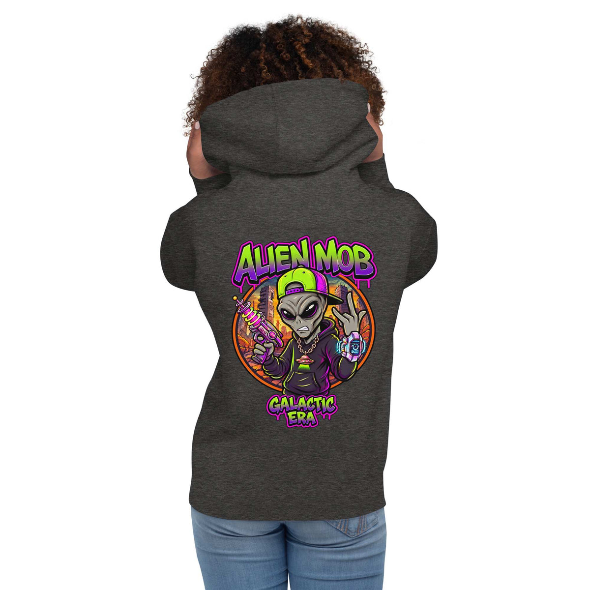 A woman  shown from the back wearing a dark charcoal gray hoodie with a colorful 'Alien Mob Galactic Era' graphic on the back, paired with blue jeans against a plain white background.
