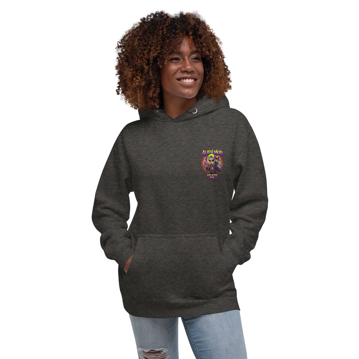 woman  wearing a charcoal  hoodie with an alien mob ' text logo on the left side chest  on a white background
