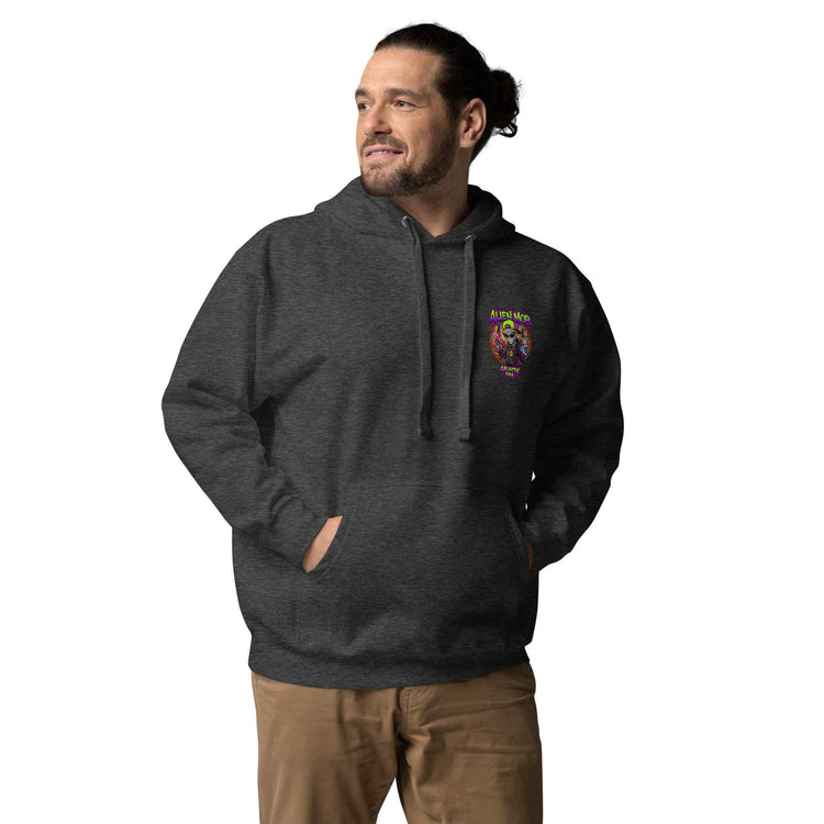 Man wearing a dark charcoal hoodie with an alien mob logo on a white background