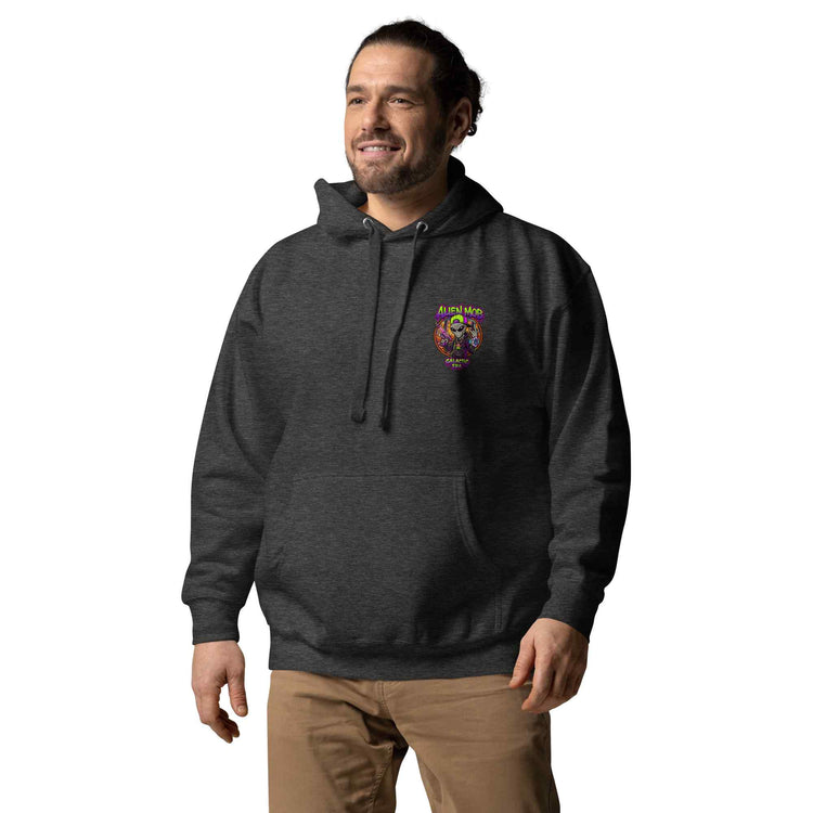 Man wearing a charcoal hoodie with an alien mob small logo on a white background