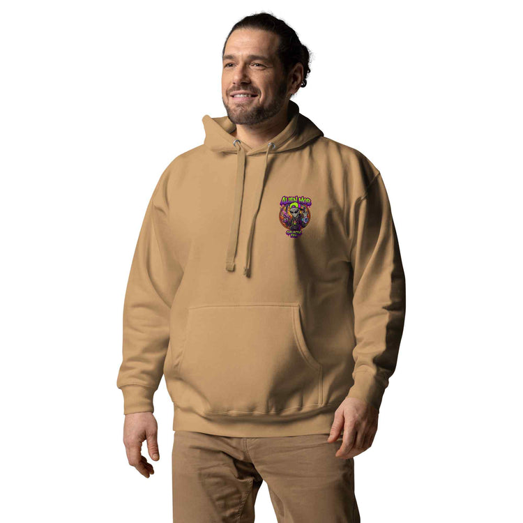 Man wearing a khaki color  hoodie with an alien mob  logo on a white background