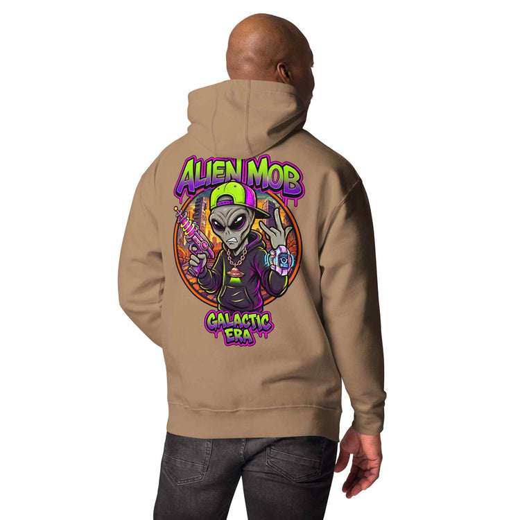 a latte color  hoodie with an alien hip hop graphic design on the back, worn by a man