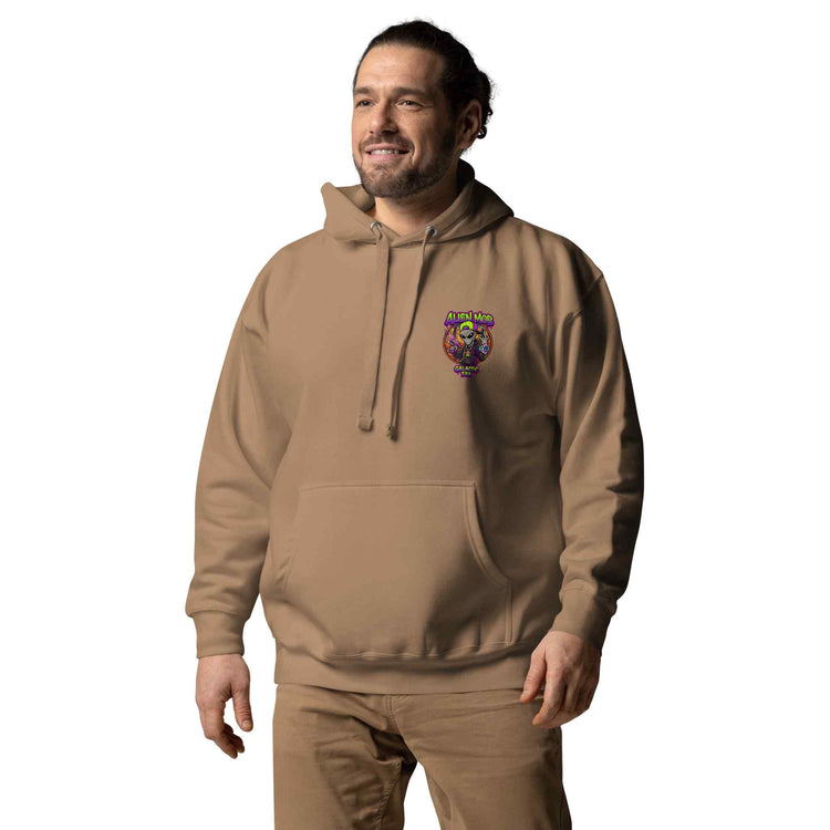 Man wearing a latte color hoodie with an alien mob logo on  left side chest  on a white background