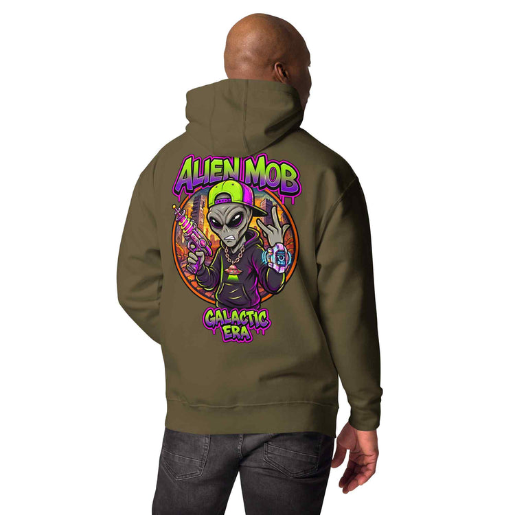 A man shown from the back wearing a military color  hoodie with a large colorful graphic on the back featuring an alien and the text 'ALIEN MOB GALACTIC ERA'.