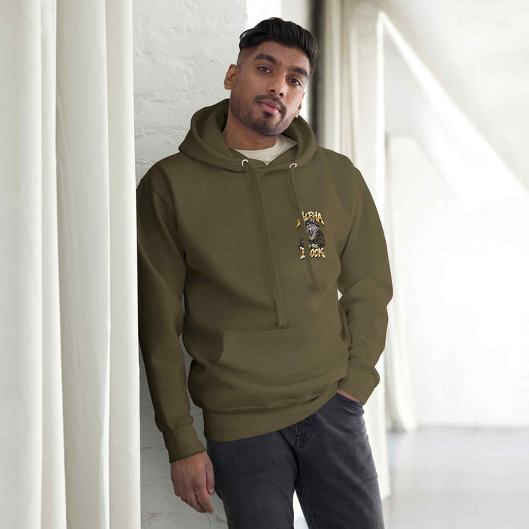 Man wearing a green hoodie leaning against a white wall. With wolf print on the left side chest