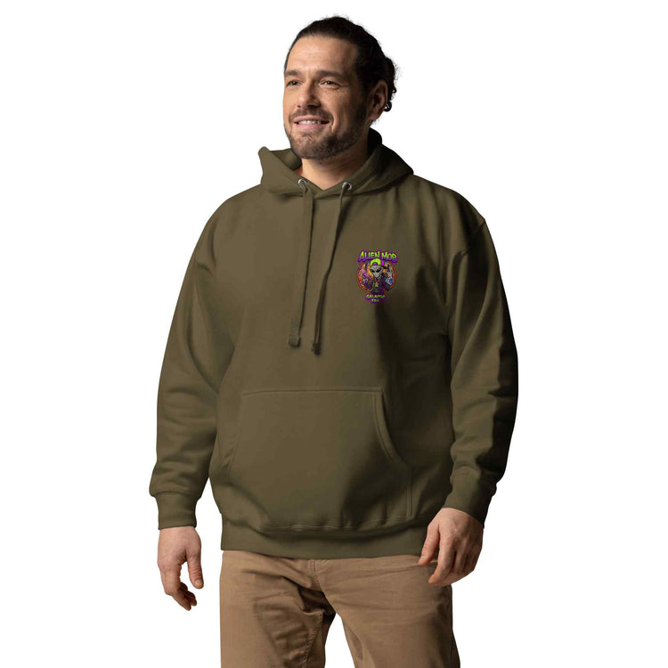 Man wearing a military color hoodie with an alien mob logo on the left side chest on a white background
