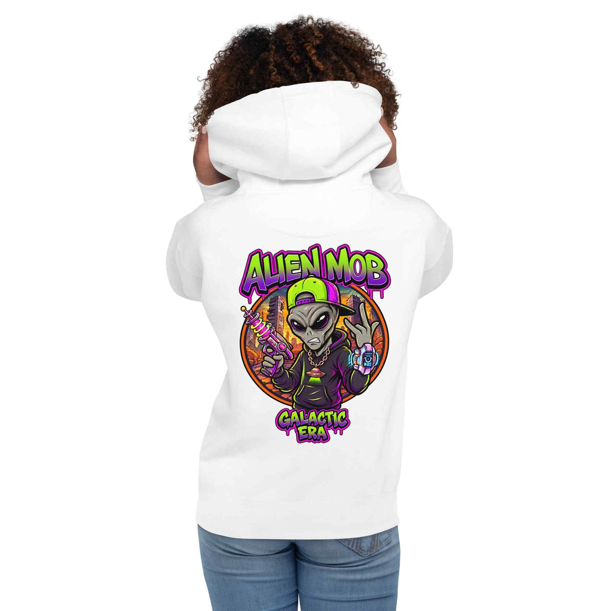 A woman  shown from the back wearing a white hoodie with a colorful 'Alien Mob Galactic Era' graphic printed on the back, paired with blue jeans against a plain white background.