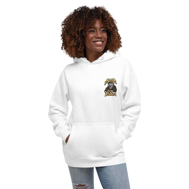 A woman with curly brown hair wearing a white pullover hoodie with a wolf logo graphic on the left chest, paired with light blue jeans, set against a plain white background.