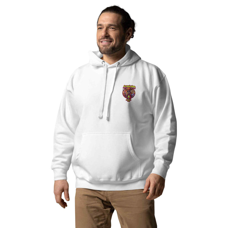 man wearing a white color hoodie with a logo on the left side chest of a design alien mob cowboy outlaw paired with khaki jeans on a white background front view