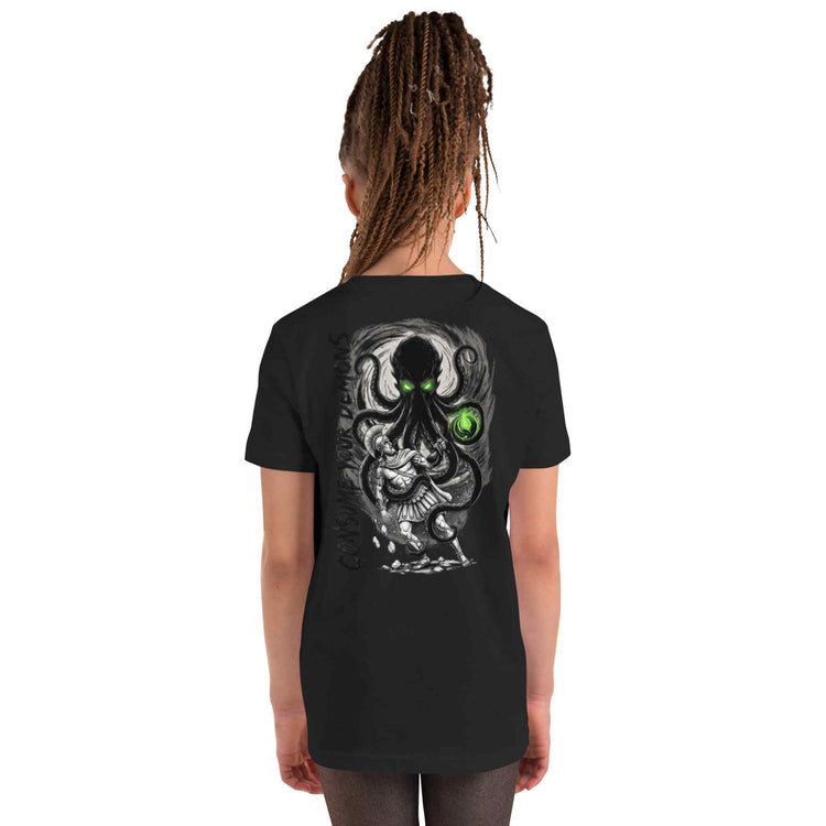 kid wearing a black  t-shirt  with kraken design on a white background
