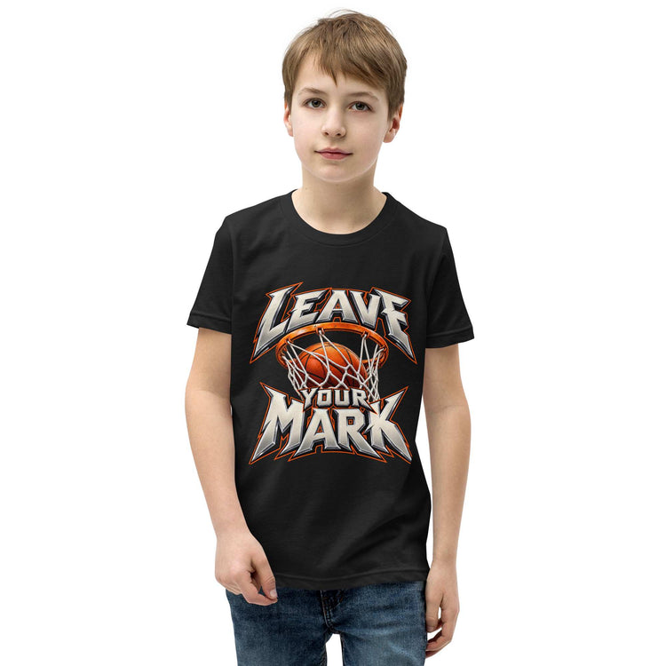 A young boy wearing a black short-sleeve t-shirt with graphic Leave your mark basketball  print  on the front, paired with blue jeans, set against a plain white background.