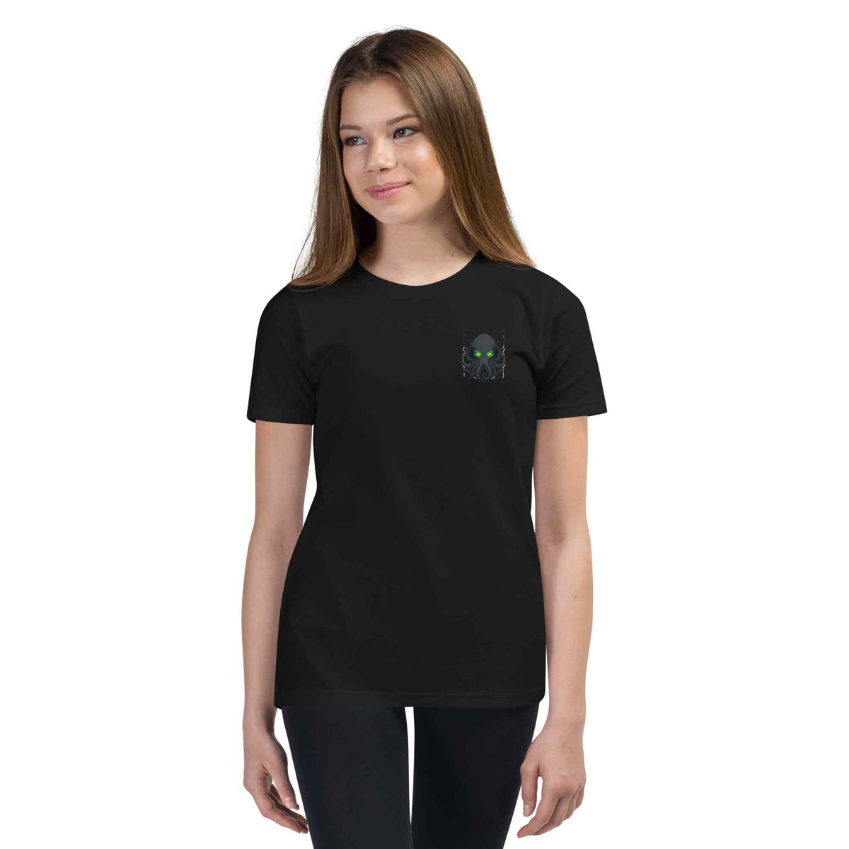 Person wearing a black t-shirt with 'kraken text  consume your demons on a white background 