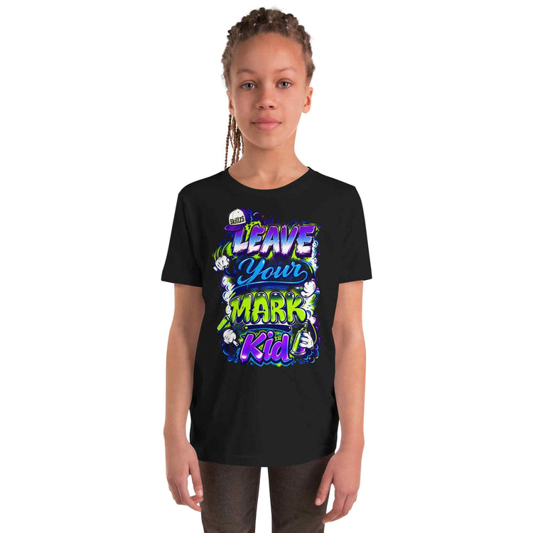 A child model wearing a black short-sleeve graphic t-shirt with a colorful 'Leave Your Mark Kid' design on the front, set against a plain white background.