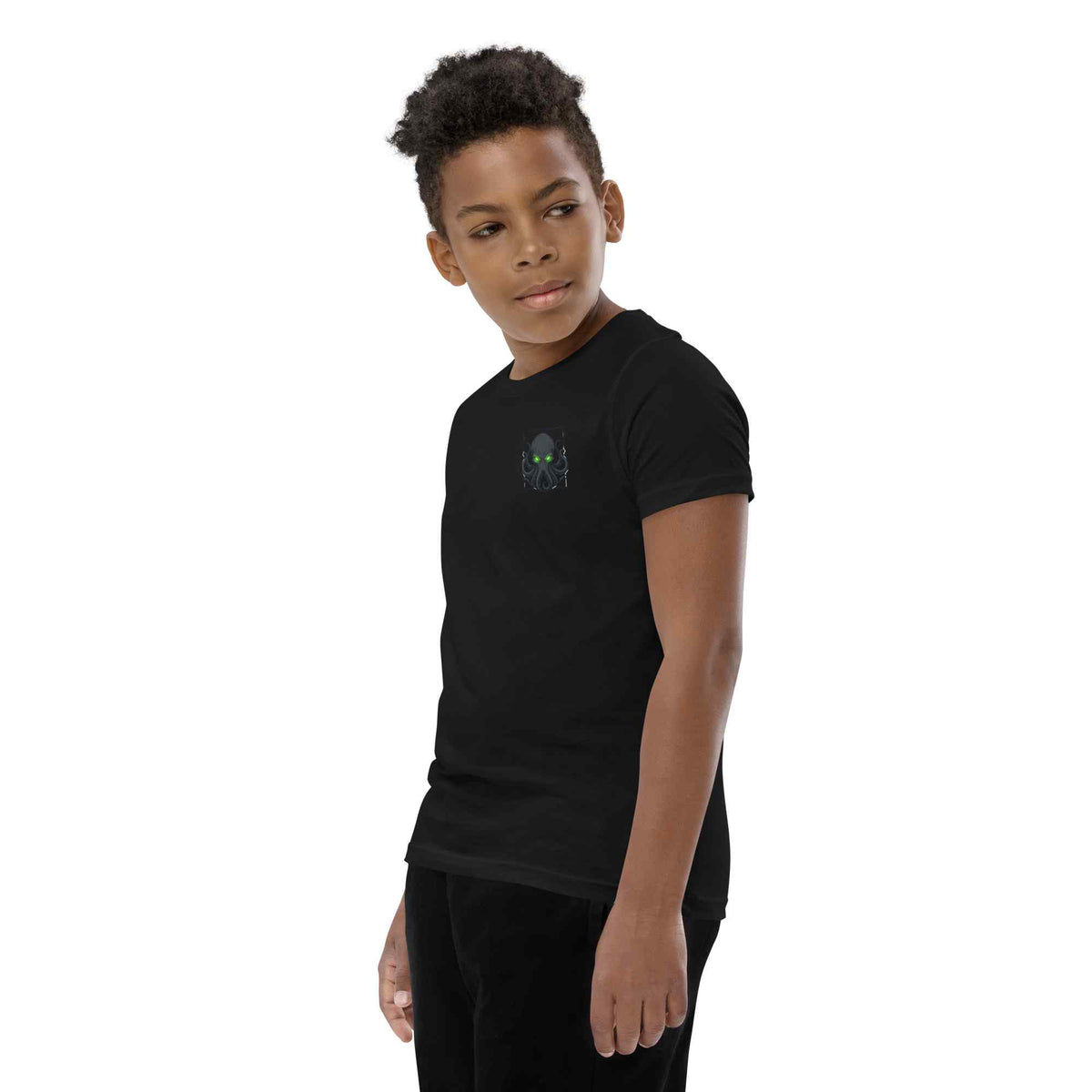 Child wearing a black t-shirt with a kraken  logo on a white background