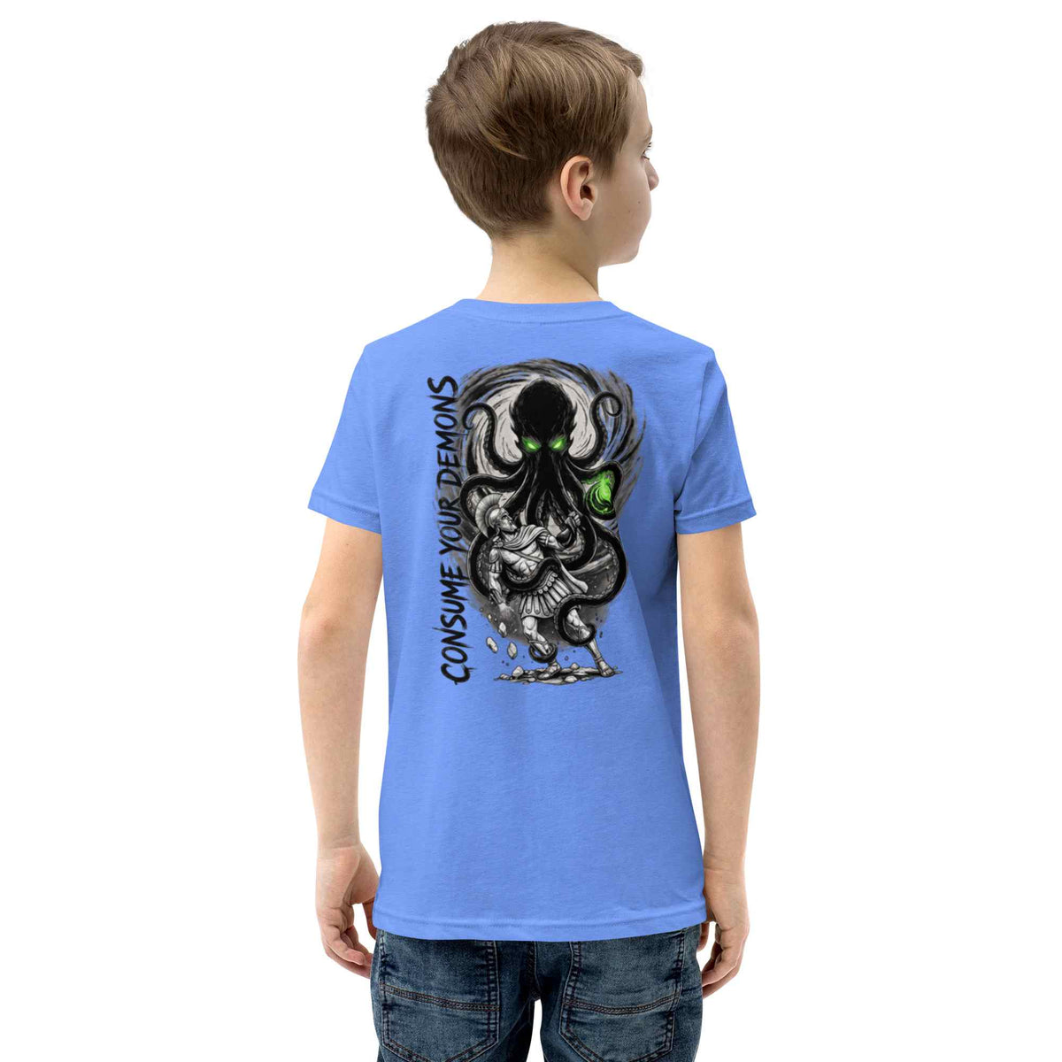 Child wearing a blue t-shirt with a kraken on the back against a white background