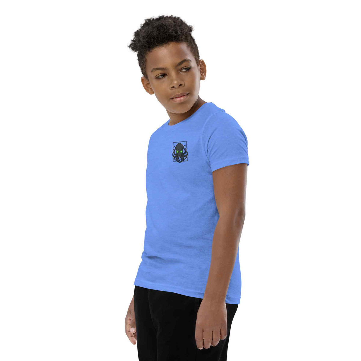 Child wearing a blue t-shirt with a kraken logo on a white background