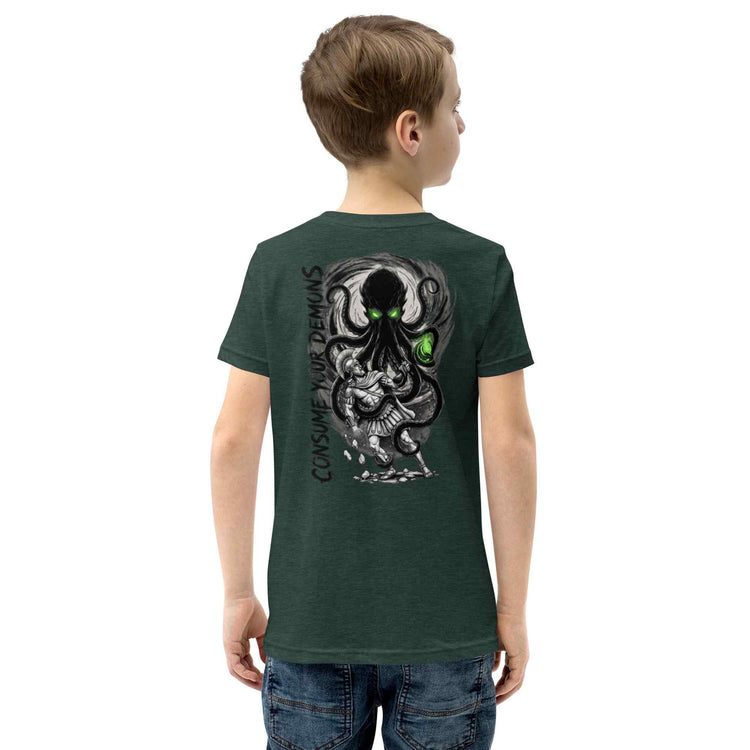 A child model shown from the back wearing a dark green t-shirt with a large graphic of a black octopus-like creature and a white dragon on the back, paired with blue jeans against a plain white background.